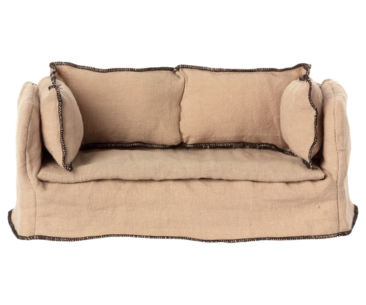 This charming miniature couch is the perfect spot for size 1 and 2 bunnies, rabbits, or members of the Teddy family to relax. With a sturdy wooden frame, a soft linen cover and cushions, it makes any dollhouse feel warm and inviting. Pair it with a miniature coffee table to create a cosy space for teatime or storytelling.