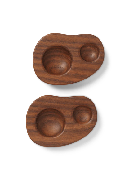 Two wooden trays with curved edges on a white background