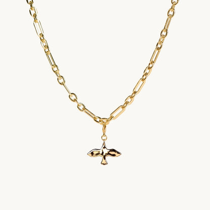 Gold necklace with a small dove pendant on a white background