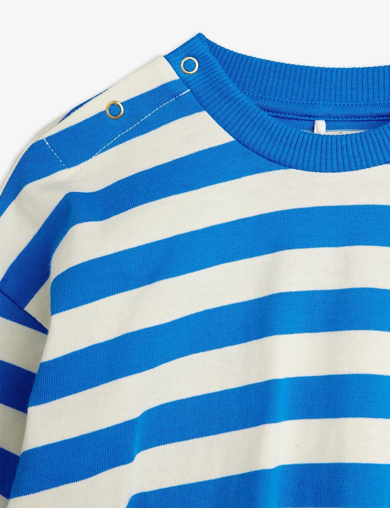 Close-up of a blue and white striped shirt with a brand label.