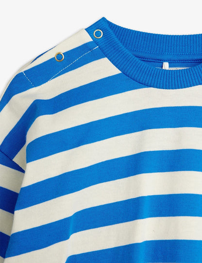 Close-up of a blue and white striped shirt with a brand label.