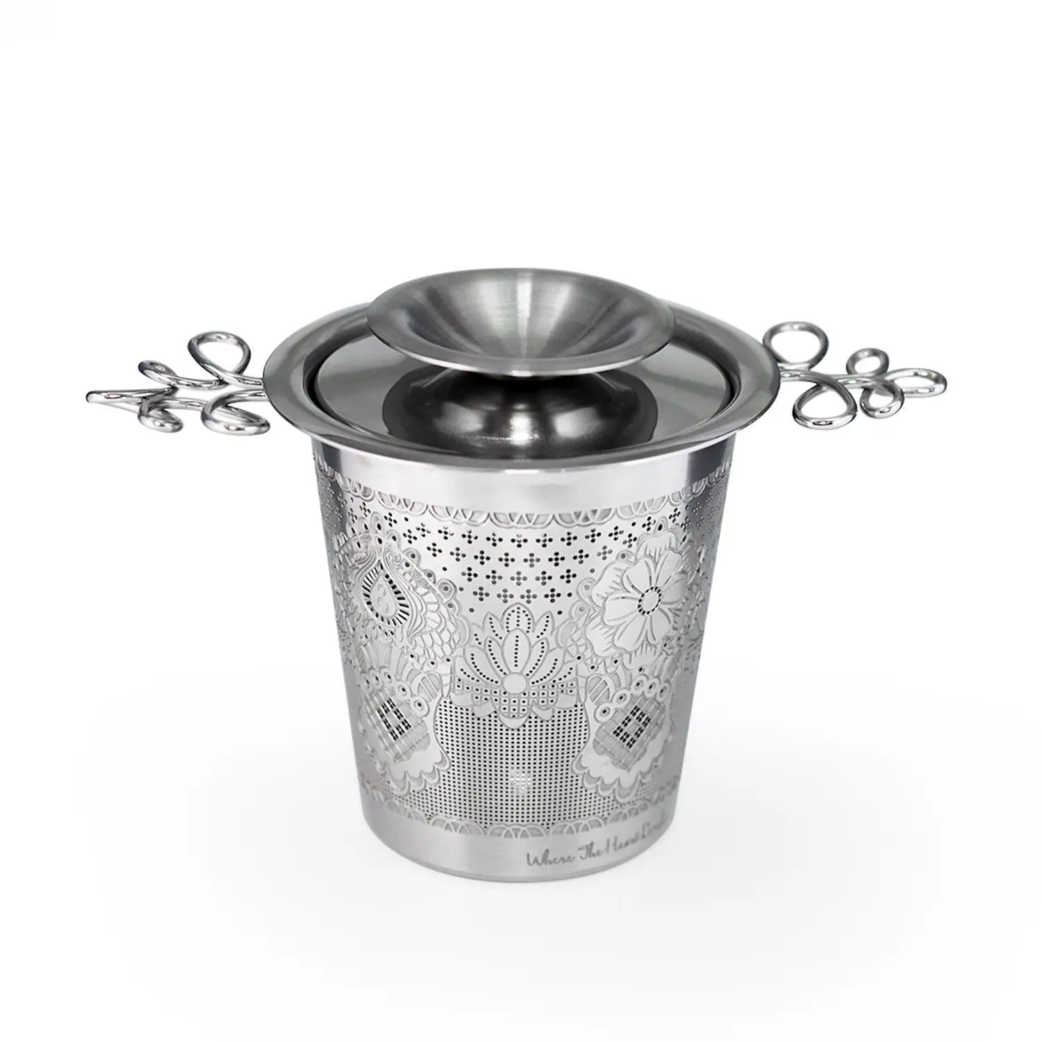 Decorative metal ice bucket with floral patterns on a white background