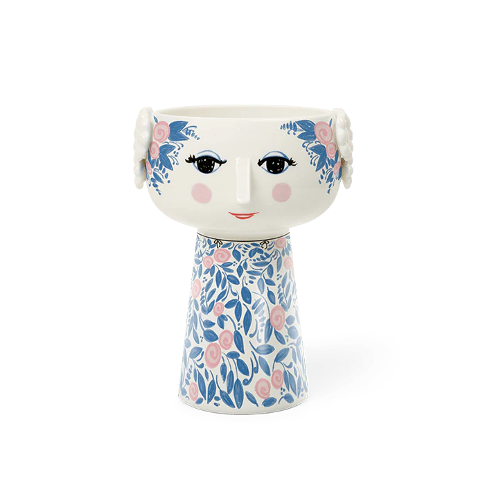 Decorative vase with floral design and face details on a white background