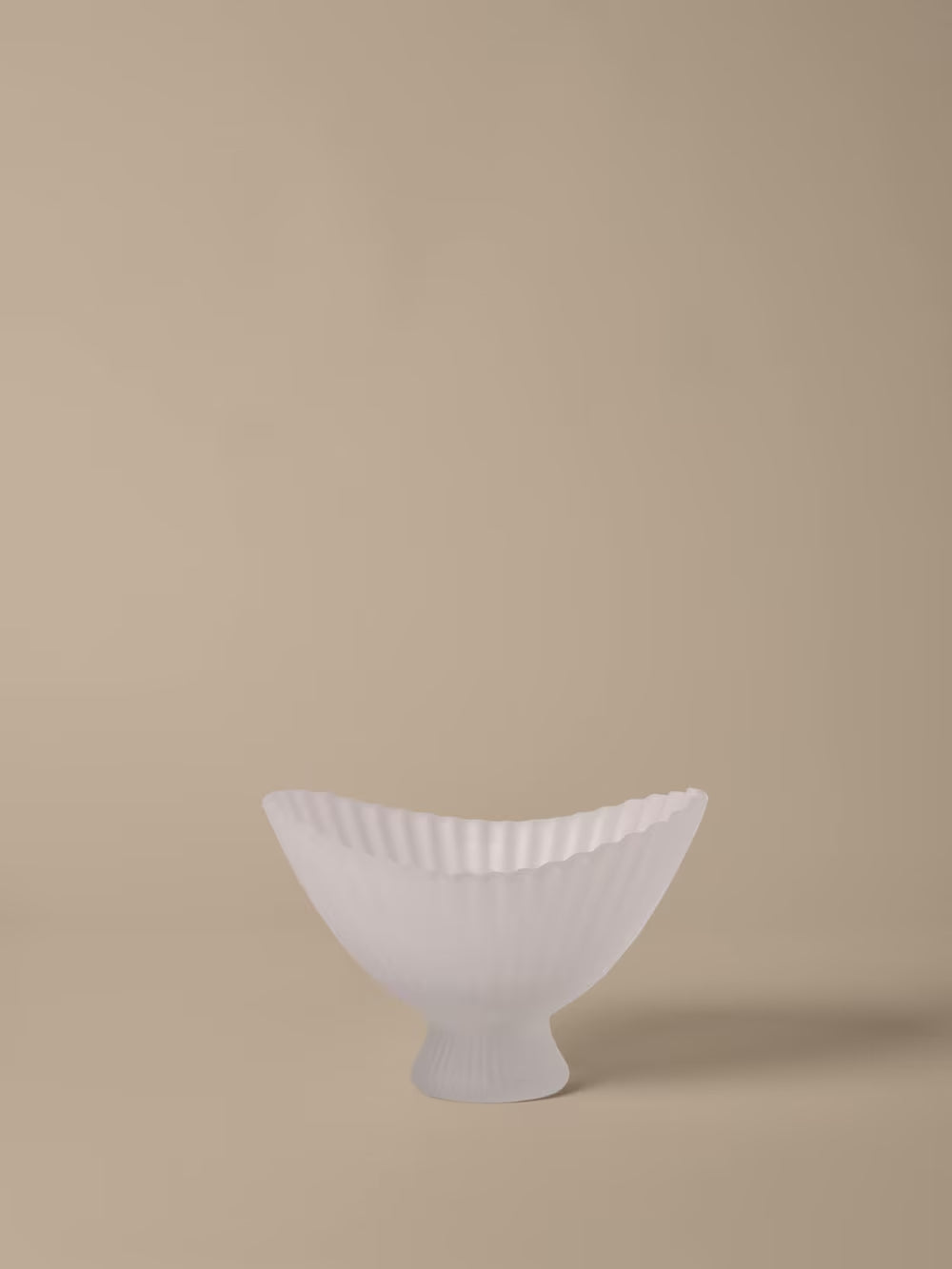 Large White ceramic bowl on a beige background