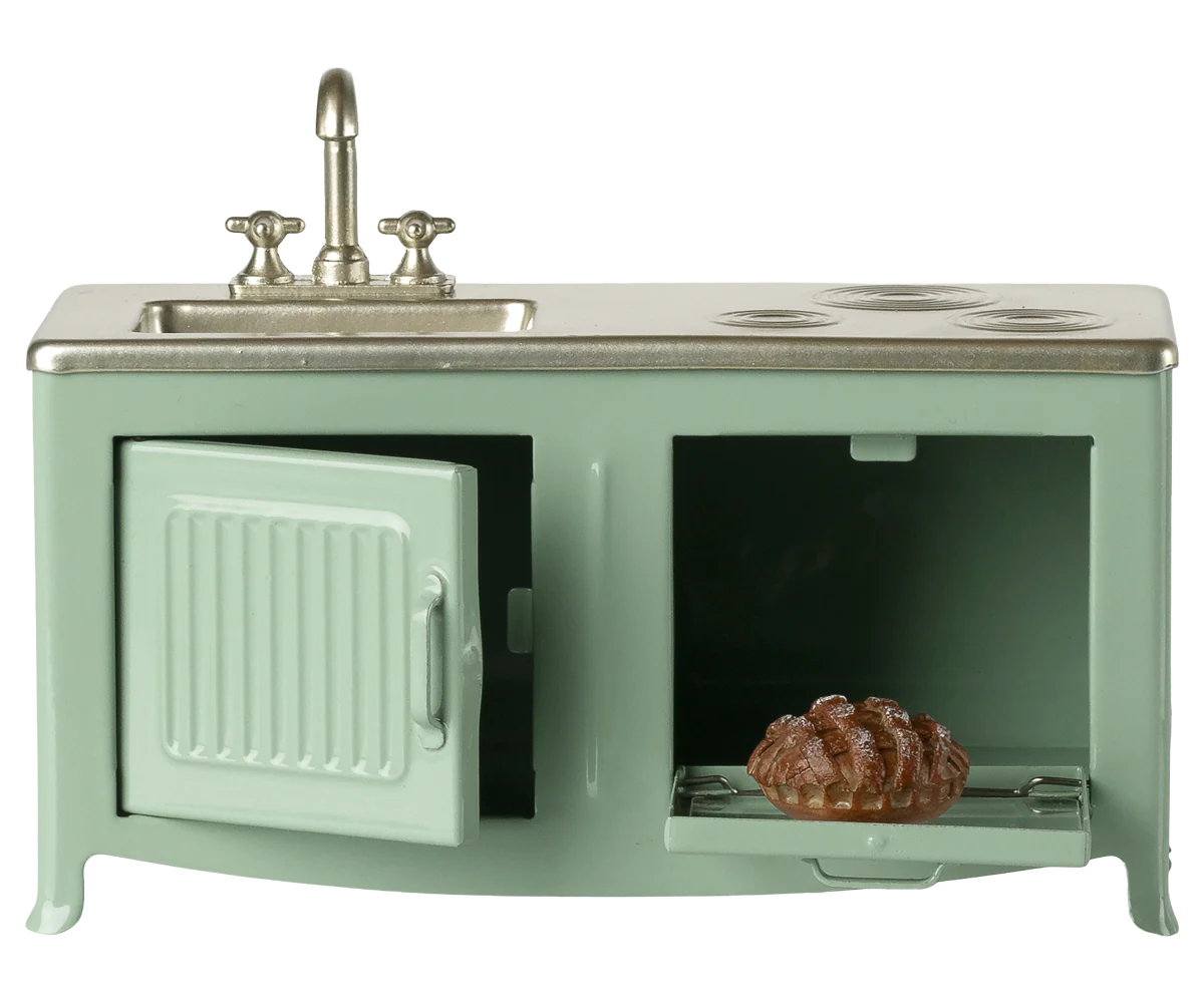 The kitchen is the heart of every home. This kitchen's has many playful details such as the pleasant hue and subtle details like the cabinets, sink, and oven with freshly-baked pie. It's the perfect size for the mouse family.