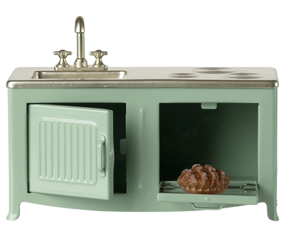 The kitchen is the heart of every home. This kitchen's has many playful details such as the pleasant hue and subtle details like the cabinets, sink, and oven with freshly-baked pie. It's the perfect size for the mouse family.