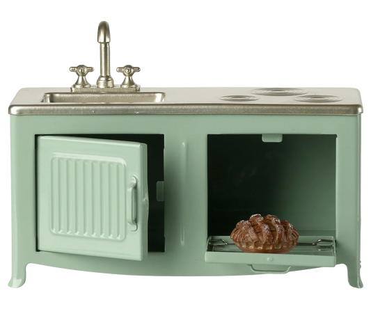 The kitchen is the heart of every home. This kitchen's has many playful details such as the pleasant hue and subtle details like the cabinets, sink, and oven with freshly-baked pie. It's the perfect size for the mouse family.