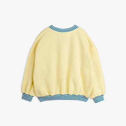 Yellow sweater with blue stripes on a white background