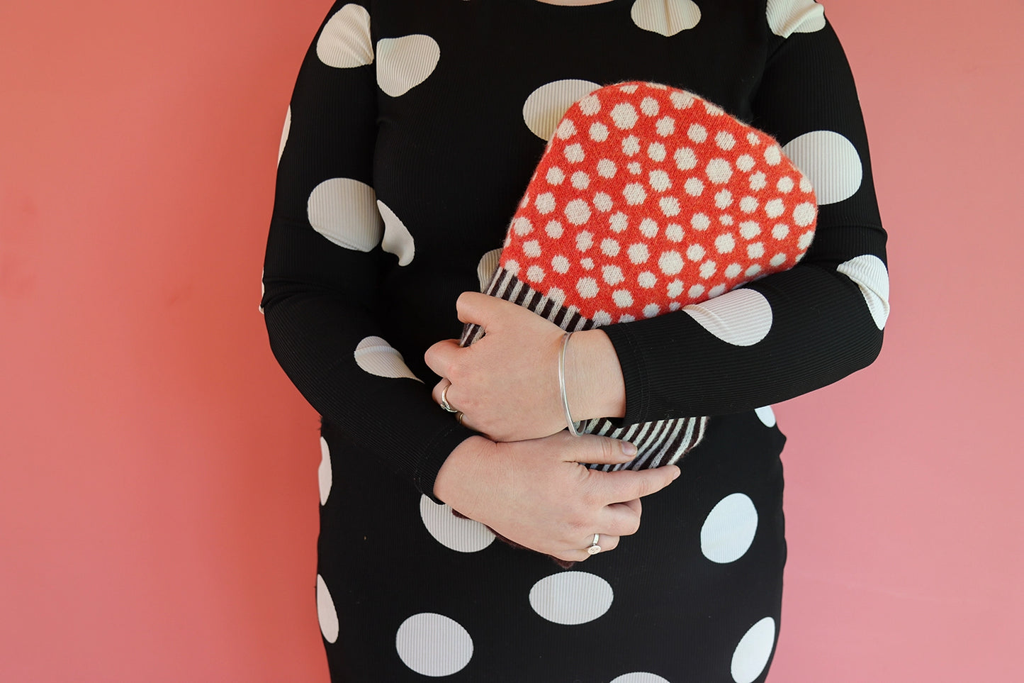 Cosy up with with this dotty Mushroom Hot Water Bottle. Use this hot water bottle with a knitted cover to keep warm on a chilly evening or to soothe your aches and pains.
