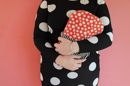 Cosy up with with this dotty Mushroom Hot Water Bottle. Use this hot water bottle with a knitted cover to keep warm on a chilly evening or to soothe your aches and pains.
