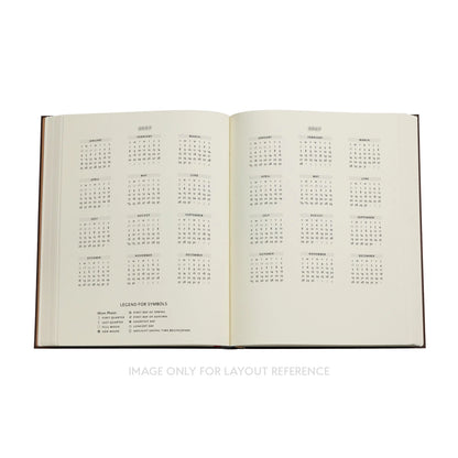 Open book with calendar pages on a white background