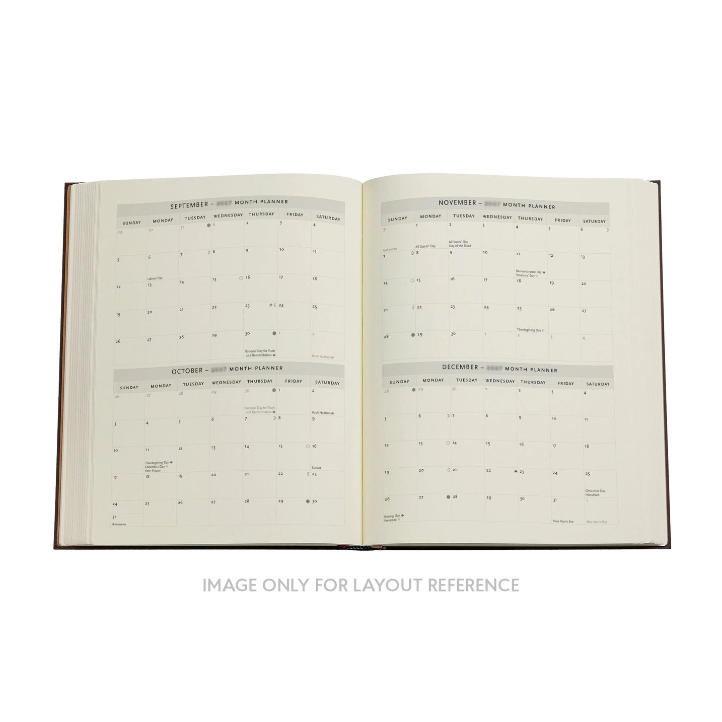Open book with calendar pages on a white background