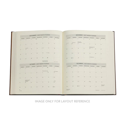 Open book with calendar pages on a white background