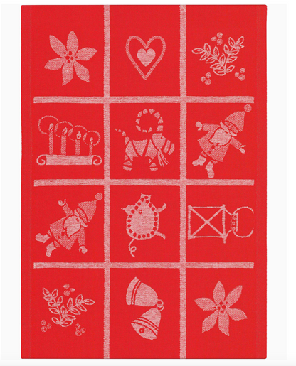 Red towel with white embroidered patterns of animals and objects on a red background