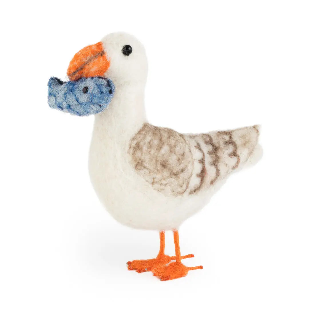 Stuffed toy goose with orange beak and feet on a white background