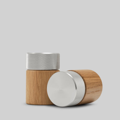 Wooden salt and pepper grinders made of oak and steel made in Denmark by the brand Gejst. They are high powered grinders that create a smooth fine grindand the natural oak grain against the textured steel provides a modern warm feel and look. Find at Huset Shop a Scandinavian Design store in Venice California