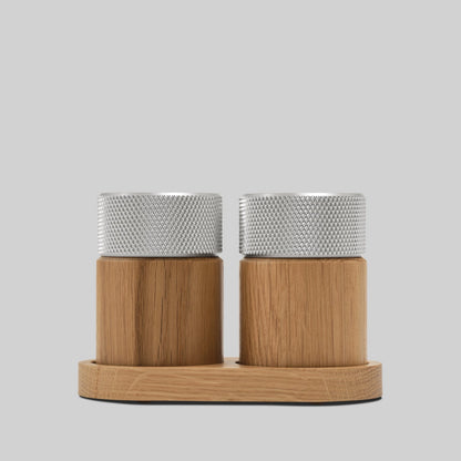 Wooden salt and pepper grinders made of oak and steel made in Denmark by the brand Gejst. They are high powered grinders that create a smooth fine grindand the natural oak grain against the textured steel provides a modern warm feel and look. Find at Huset Shop a Scandinavian Design store in Venice California