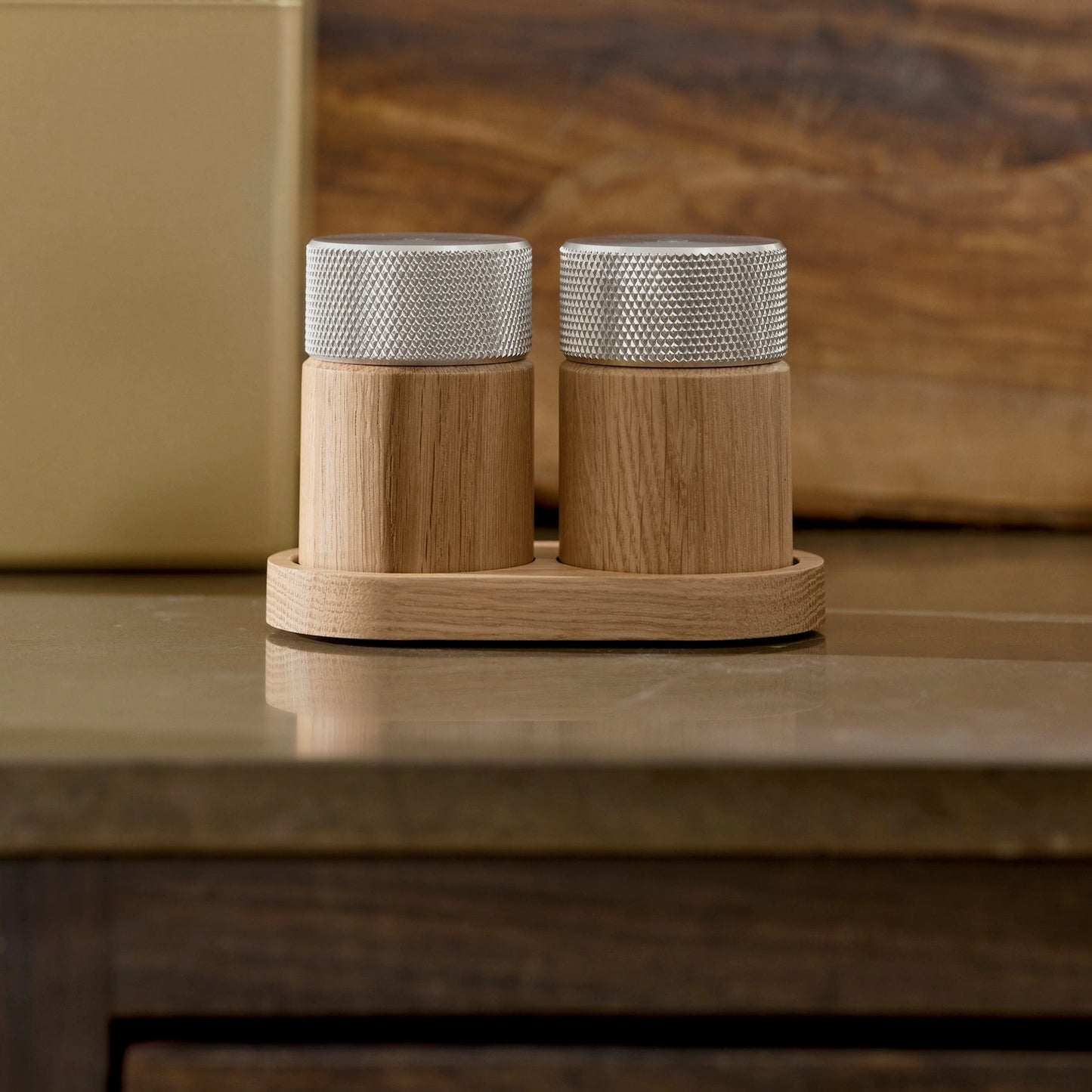 Wooden salt and pepper grinders made of oak and steel made in Denmark by the brand Gejst. They are high powered grinders that create a smooth fine grindand the natural oak grain against the textured steel provides a modern warm feel and look. Find at Huset Shop a Scandinavian Design store in Venice California