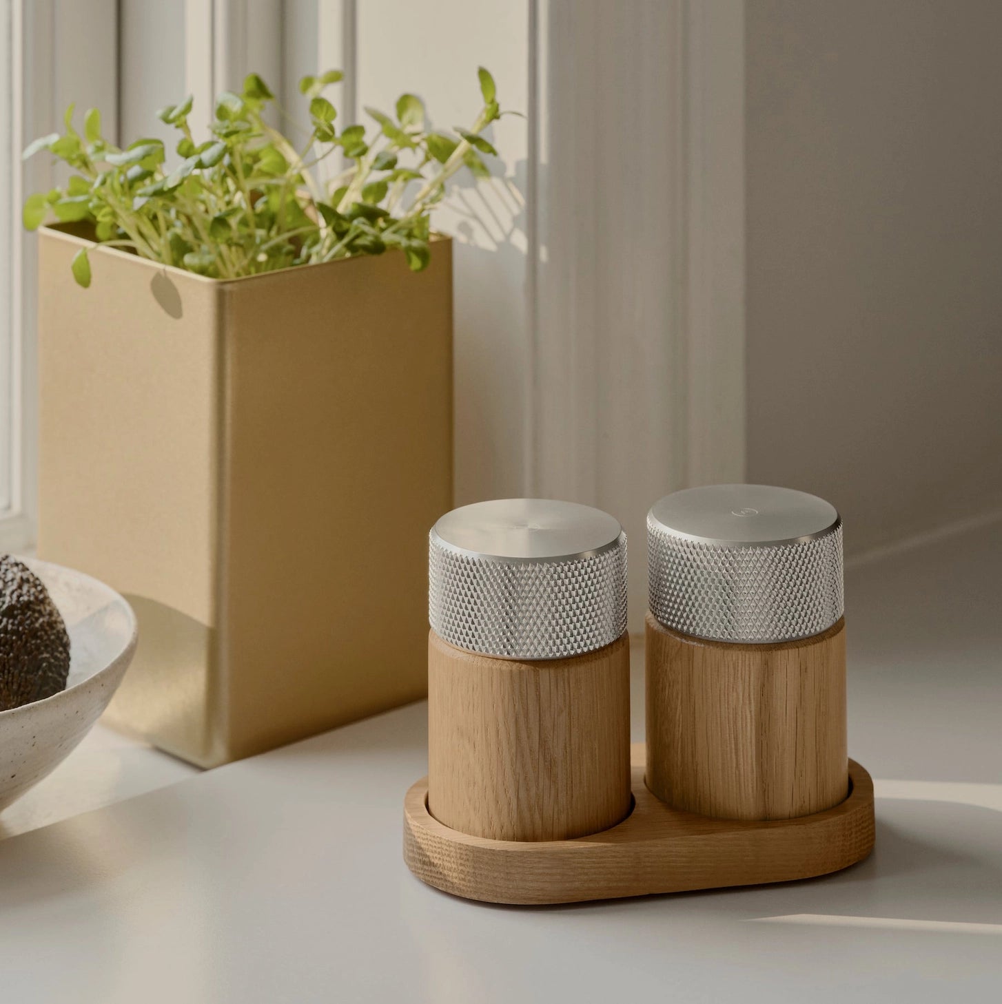 Wooden salt and pepper grinders made of oak and steel made in Denmark by the brand Gejst. They are high powered grinders that create a smooth fine grindand the natural oak grain against the textured steel provides a modern warm feel and look. Find at Huset Shop a Scandinavian Design store in Venice California