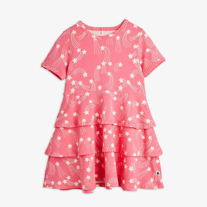 Pink dress with star and moon pattern on a white background