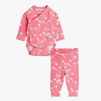 Pink baby outfit with white star pattern on a white background