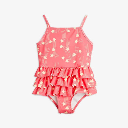 Pink children's swimsuit with star and moon pattern on a white background