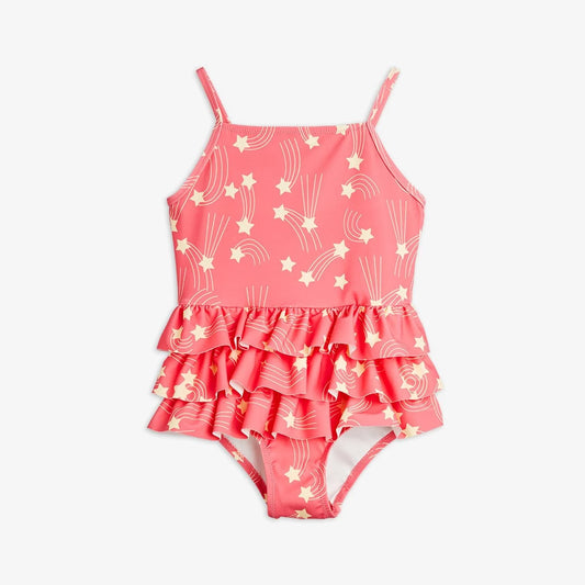 Pink children's swimsuit with star and moon pattern on a white background