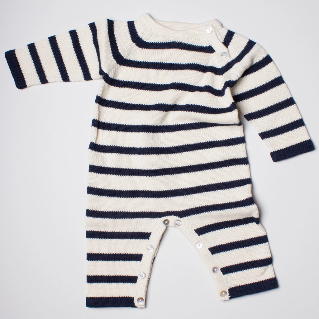 Striped baby romper with long sleeves on a light gray background