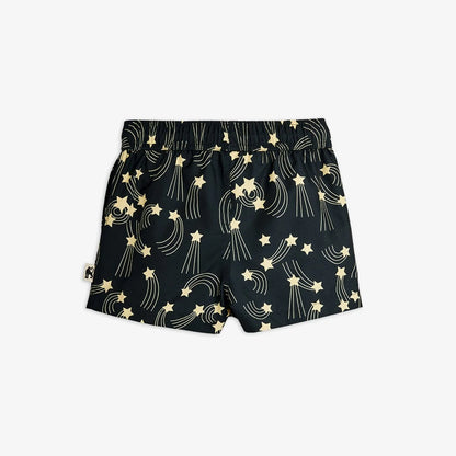 Black shorts with gold star and moon pattern on a white background