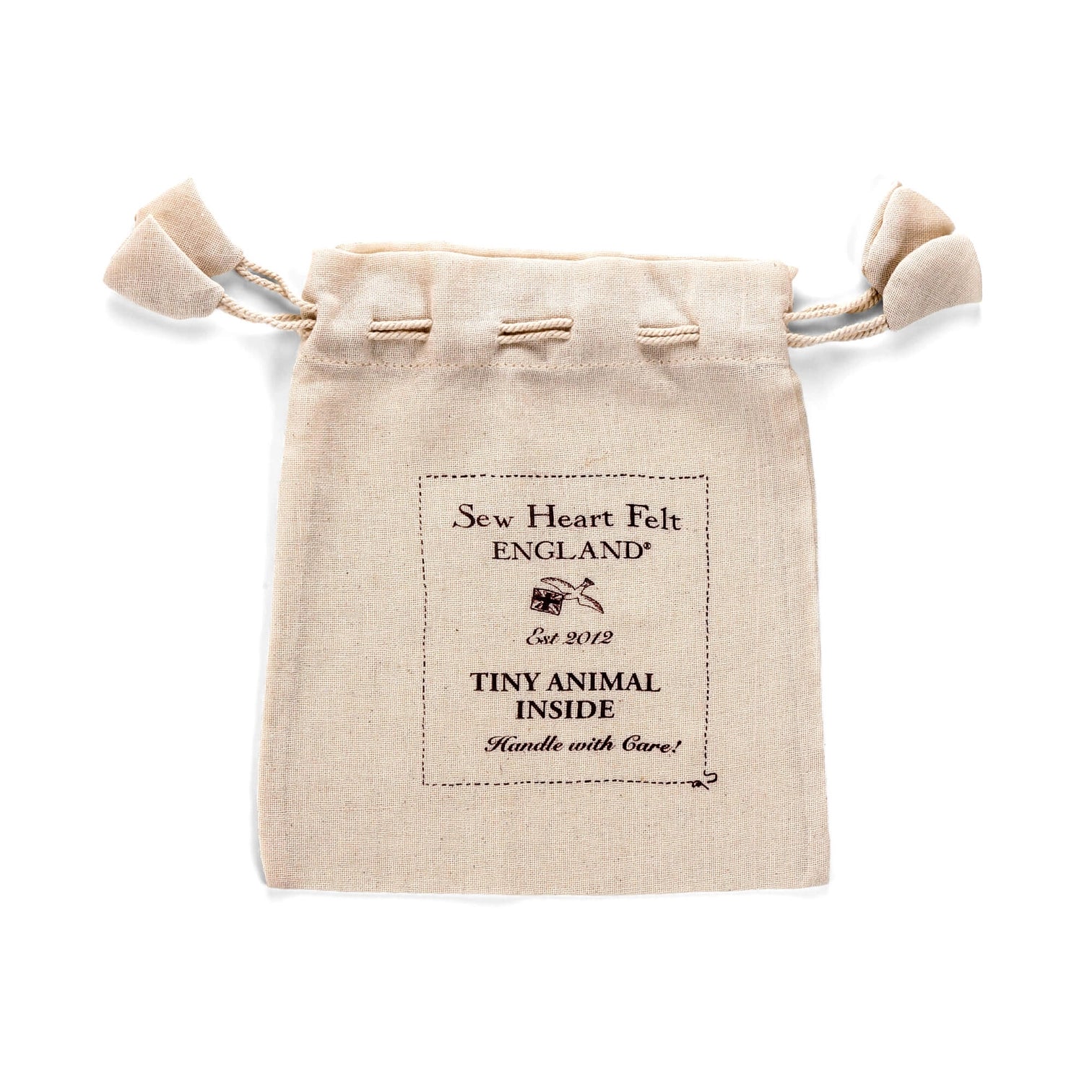 Beige drawstring pouch with 'Sew Heart Felt England' branding on a white background