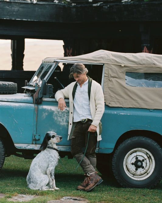 The Heroes Cardigan combines timeless style with premium Norwegian wool craftsmanship. Knitted from 100% Norwegian wool, this versatile cardigan offers natural warmth and breathability, making it ideal for layering during changing weather conditions. Refined waxed cotton details add classic outdoor styling while providing subtle weather resistance. Whether worn as a sophisticated mid-layer on mountain adventures or as a standalone piece for casual occasions, this cardigan delivers the perfect balance of com