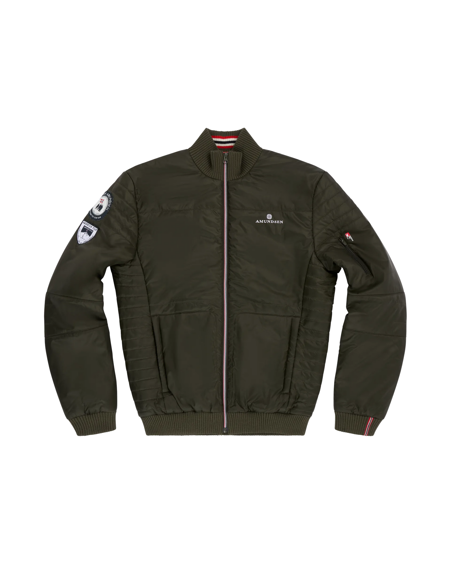 Norwegian camping or hiking, or anything involving the outdoors you will love this jacket. Lightweight durable polyamide face, 120 grams Norwegian Woolinside insulation, Cuffs, waist and neck knitted in pure merino wool, Antarctic Tartan lining
Amundsen Peak patches on upper sleeves. He is using a camping stove to make some coffee surrounded by trees.