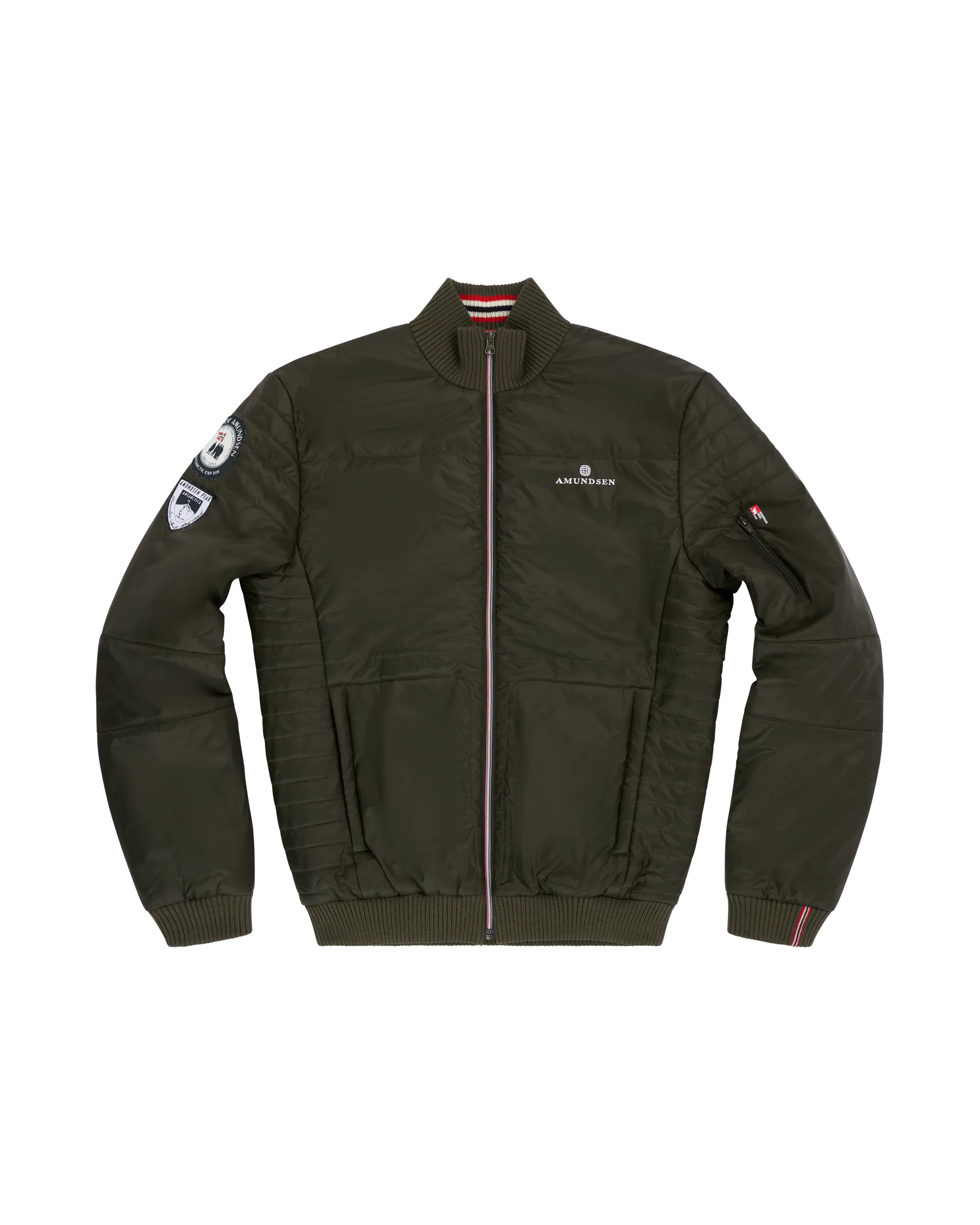 Norwegian camping or hiking, or anything involving the outdoors you will love this jacket. Lightweight durable polyamide face, 120 grams Norwegian Woolinside insulation, Cuffs, waist and neck knitted in pure merino wool, Antarctic Tartan lining
Amundsen Peak patches on upper sleeves. He is using a camping stove to make some coffee surrounded by trees.