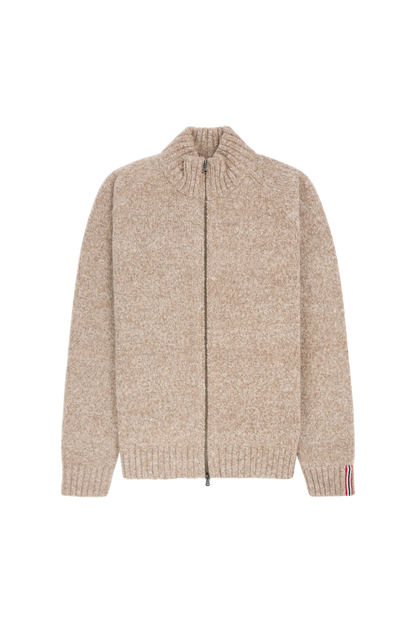 a beige sweater with a Norwegian flag detail on the inner wrist, Scandinavian Men's fashion found in Los Angeles at Huset Shop your home for all things Scandinavian and men's outdoor gear shopping in Venice California.