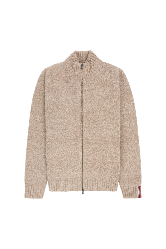 a beige sweater with a Norwegian flag detail on the inner wrist, Scandinavian Men's fashion found in Los Angeles at Huset Shop your home for all things Scandinavian and men's outdoor gear shopping in Venice California.