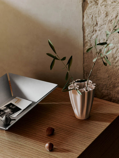 Echoing the elaborate patterns of a 'Dédales' or labyrinth, the Dedali Vase is a fusion of art and utility. Crafted from 3D-printed ceramic, its labyrinth-like top is not only aesthetically pleasing but also functional for arranging flowers in a voluminous, Ikebana-style.