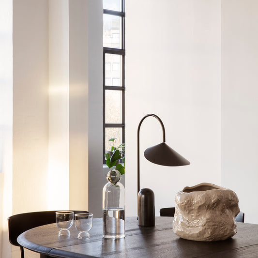 Ferm Living's&nbsp;Still series of mouth-blown glass tableware looks to traditional tea making rituals, simplicity and balance to create everyday objects rooted in beauty and function. The lightweight, hourglass-shaped glasses, available as a set of two, are formed from contrasting sizes of the same gently rounded shape to elevate the design, making it ideal for wine as well as water.